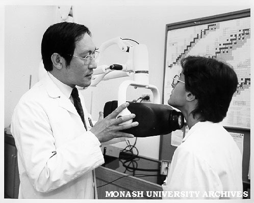 Mr Teng Tan (left) testing student Sylvie Keleman with thyroid monitor