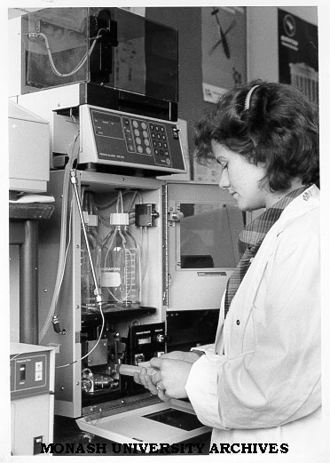 Dr Marie-Isabel Aguilar using Perkin-Elmer equipment