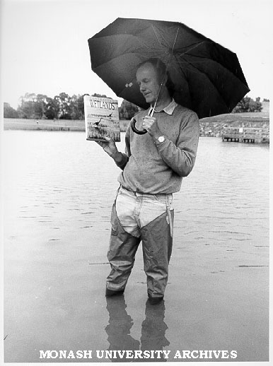 Dr Sam Lake, Director of Centre for Stream Ecology, with book 'Australian Wetlands'