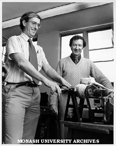 Professor Roy Jackson (left) and Dr Frank Larkins loading autoclave into furnace