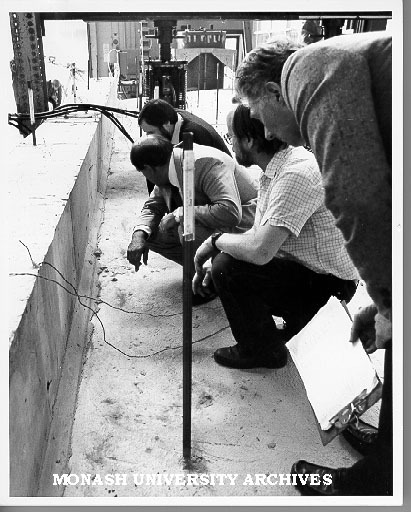 Inspecting cracking in laboratory. Mr Robert Armstrong (left), Mr David Chamberlain, Associate Professor Paul Grundy, Mr Nils Larsen - representatives of V/Line and Metrail