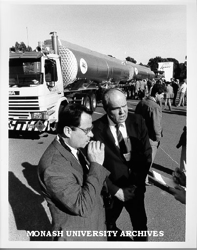 Participants in symposium on B-double semi-trailers