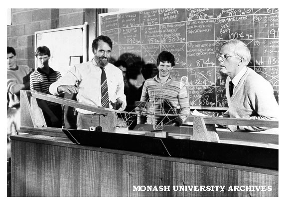 Judge, Mr Milton Johnson (right) with Professor Noel Murray and competitors in Primitive Primordial Pristine Cupreous Bridge Competition