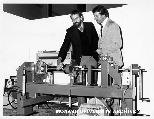 Professor Noel Murray (left) and Mr Bill Atkinson with machine to test spline shaft