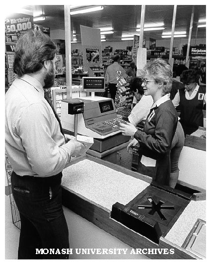 Dr Robin Shaw with cashier Sandra Botham at Schulz Licensed Supermarket, Syndal
