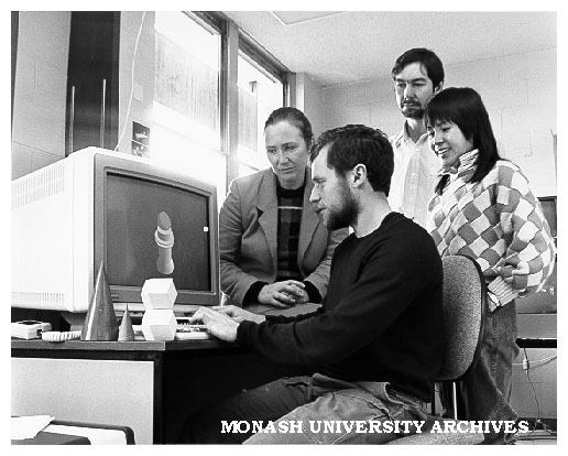 Student Damian Conway in graphics laboratory, watched by Mrs Marian Cottingham (left), Mr Anthony Maeder and Dr Binh Pham