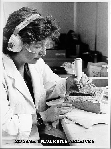 Research assistant Lesley Kool, separating dinosaur bone from rock