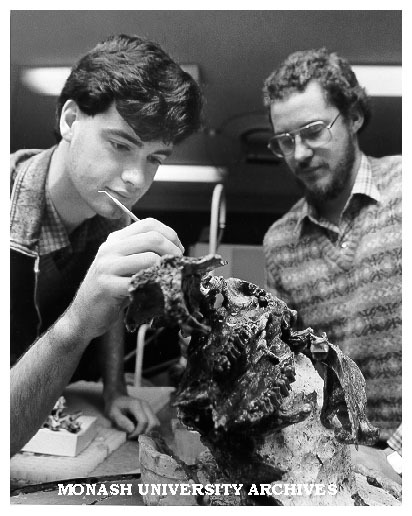 Research assistants Craig Cleeland (left) and Mick Whitelaw examining fossilised skull