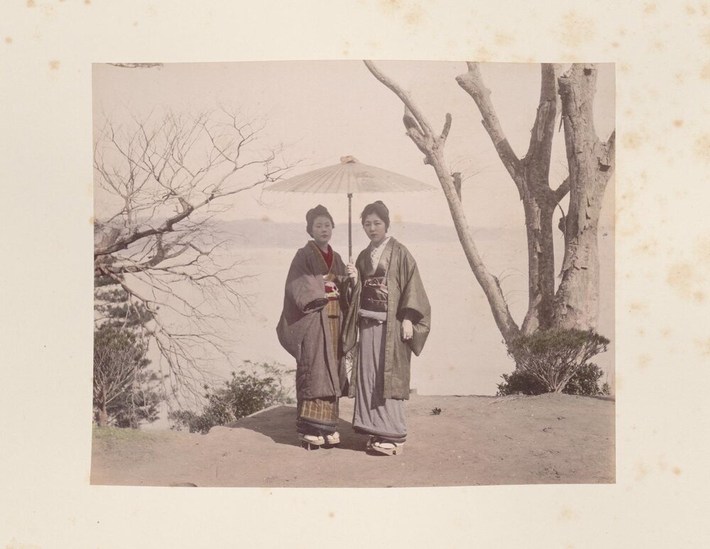 Two women under a parasol 