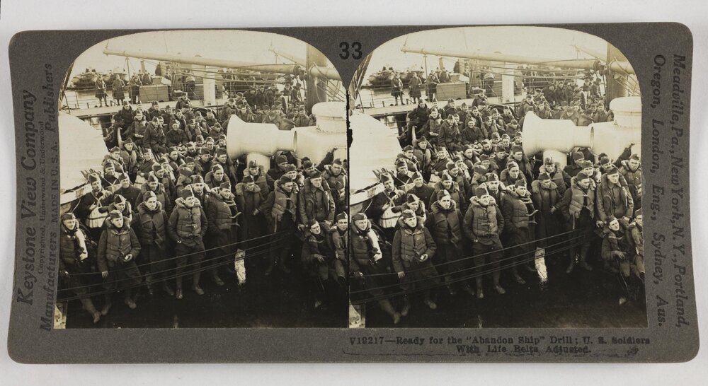 Ready for the "abandon ship" drill; U.S. soldiers with life belts adjusted
