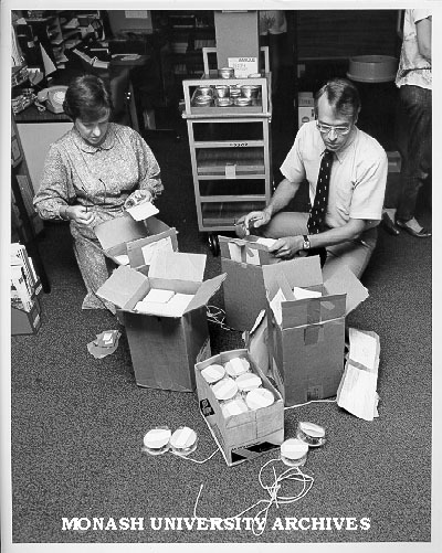 Professor Merle Ricklefs opening consignment of microfilm from Dutch National Archive