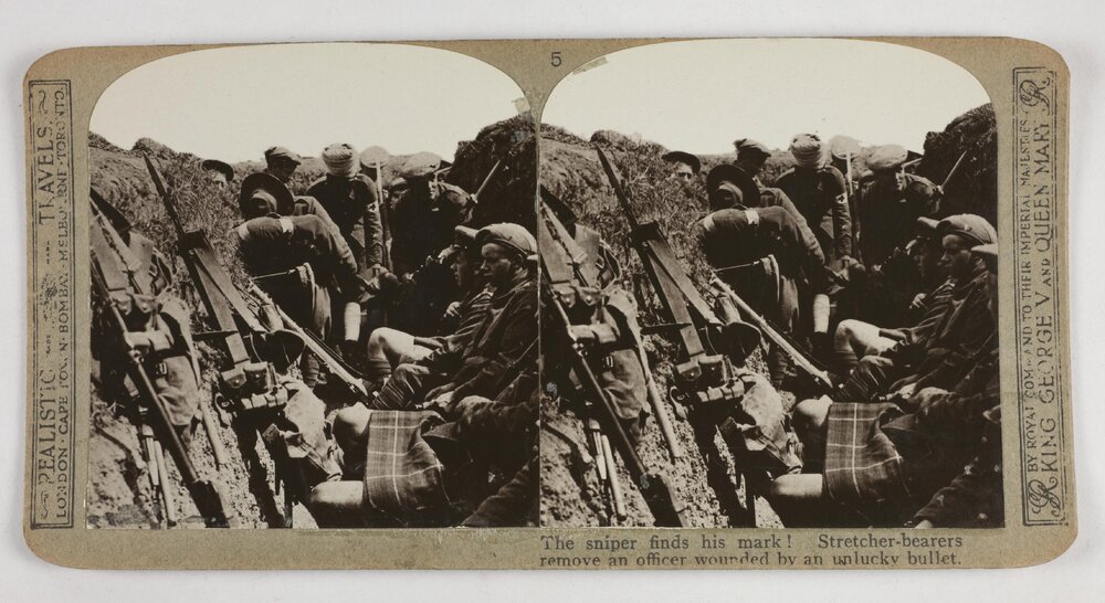 The sniper finds his mark!  Stretcher-bearers remove an officer wounded by an unlucky bullet