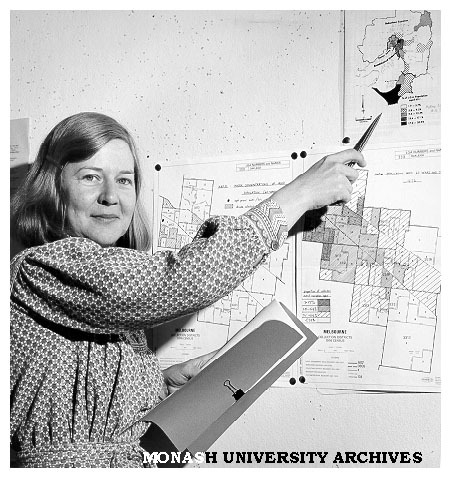 Ms Anna Howe with maps showing concentration of Melbourne's old people