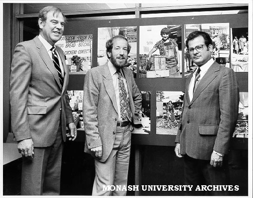 Herve Alleaume exhibition - 'Oakleigh: Portrait of the New Society'. Mr Robert Downey, Director of Victorian Ministry of Immigration and Ethnic Affairs (left), Monash geographer John McKay, and former Monash photographer Herve Alleaume