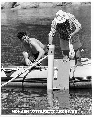 Dr Pat de Deckker (right) and Mr Greg Coomber, testing sediment trap in containment pond