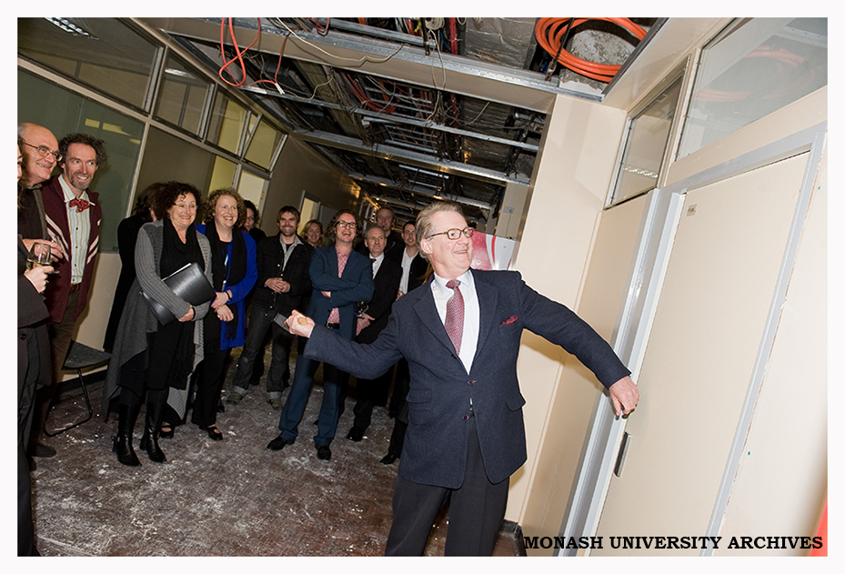 Professor John Redmond, Dean of Art and Design, smashes a door down as a symbolic start of the renovation of new facilities for MUMA at the Caulfield Campus