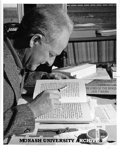 Professor Arthur Brown studying manuscript