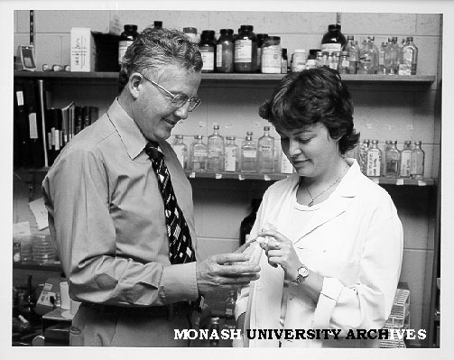 Professor Bruce Holloway and research assistant Mandy Moore examining bacterium