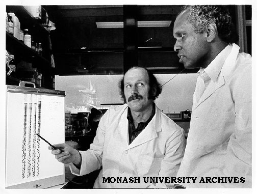 Associate Professor Viji Krishnapillai (right) discussing DNA sequence with Professor Bob Hancock from University of British Columbia