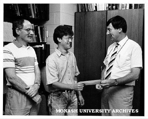 Student Cameron Johnson receiving Phyllis Hillgrove Scholarship from Dean of Science Professor Ian Rae. Dr David Smyth (left)