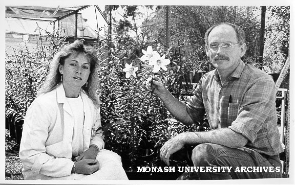 Dr David Smyth and student Ms Jenny Ryding with regal lily