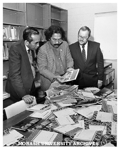 Gift of books from Indonesian Embassy. Professor Mahmud Zaki (left) Cultural and Educational Attache for Indonesian Embassy in Canberra, Indonesian tutor, Mr Basoeki Koesasi and acting chairman of Indonesian and Malay Mr Paul Tickell