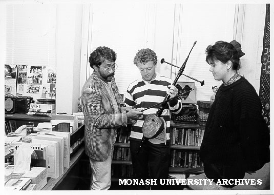 Mr Basoeki Koesasi showing Paul Shea how to play rebab, Paula Michelotti looking on