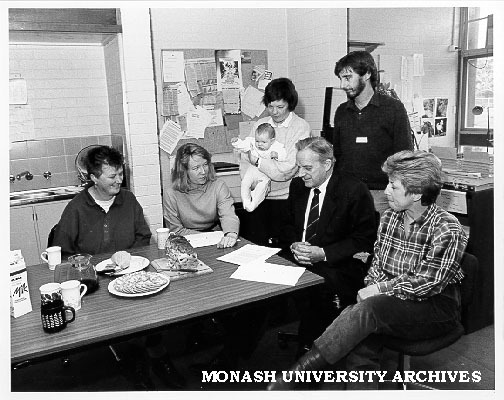 Federal Attorney-General Mr Lionel Bowen (seated second right) at Springvale Legal Service, with from left: Chris Slattery, Susanne Liden, Sue Miller and baby, Simon Smith service coordinator, and Judy Taylor
