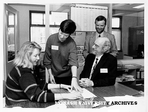 Springvale Legal Service staff, from left: Susanne Liden, Susan Miller and (standing) coordinator Adrian Evans, with Mr Julian Gardner director of Legal Aid at Legal Aid Commission of Victoria