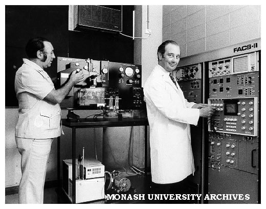 Lab manager Mr Colin Cusdin (left) and chairman of Pathology and Immunology Professor Richard Nairn making adjustments to Fluorescence Activated Cell Sorter