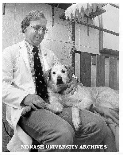 Dr Glenn Bowes and dog Sophie, trained to fall asleep in lab