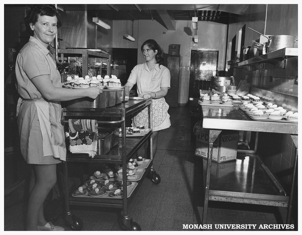 Catering staff members with desserts to be served