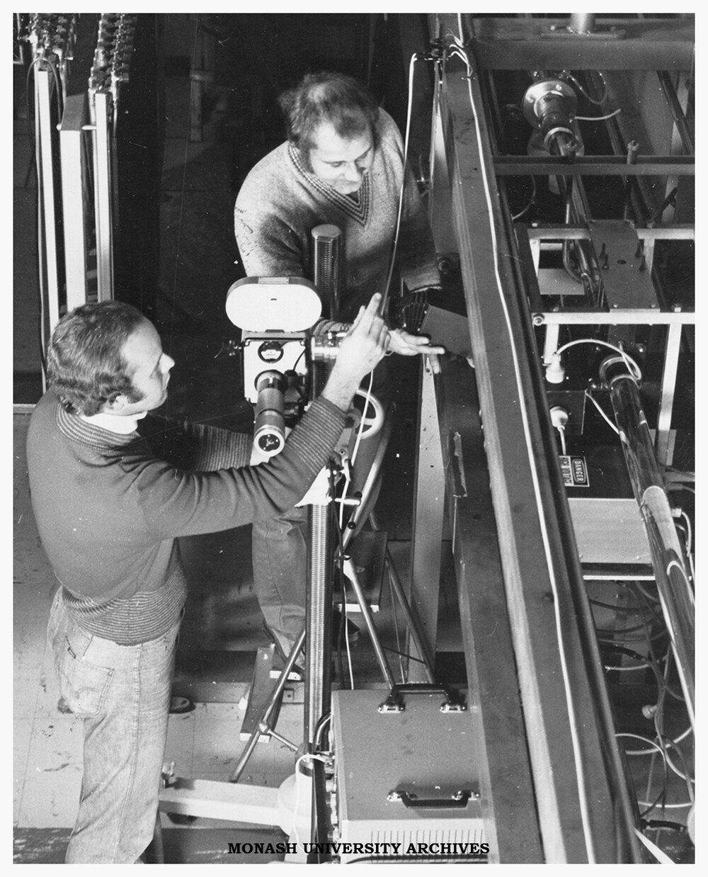 Chemical engineering postgraduate student Peter Cable and Dr David Boger preparing to film in the lab