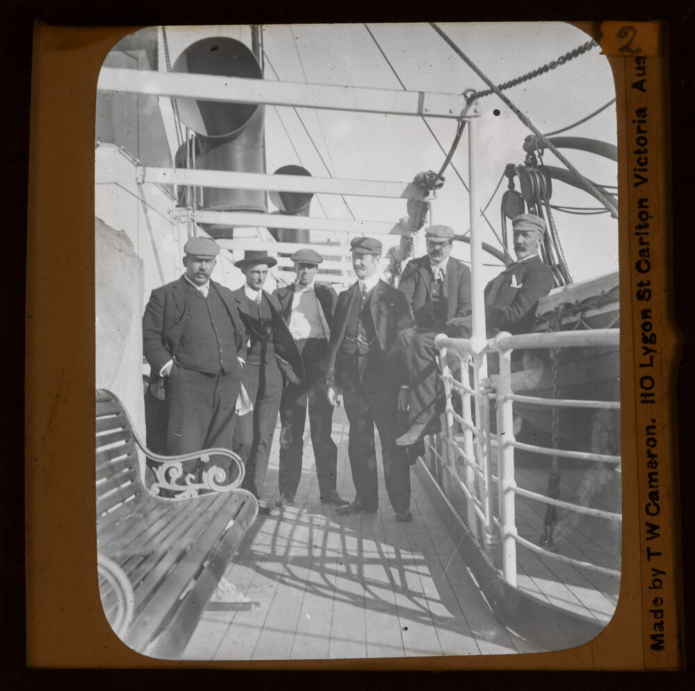 Passengers posing for a photo on ship 