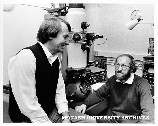 Drs Barry Muddle (left) and Richard Hannink in front of electron microscope