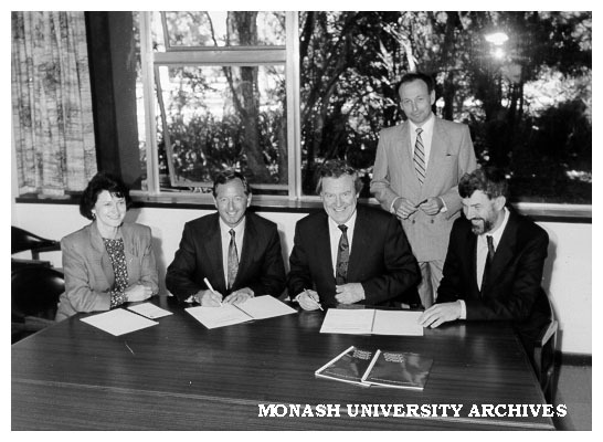 Signing contract for Plastics Association database for Centre for Advanced Materials Technology, from left: Ms Susan Ryan, Mr Tony Rogers, Professor Mal Logan, Dr Paul Hudson and Professor Paul Rossiter