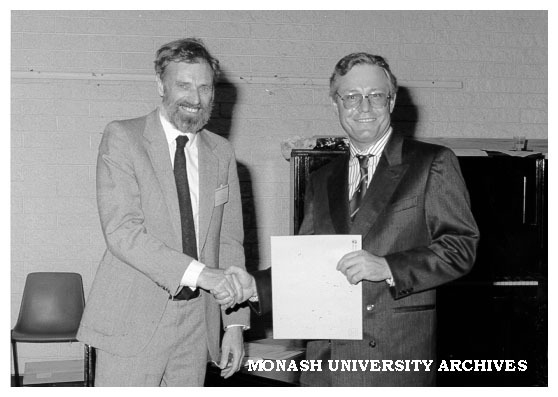Gavan Rosman (left) presenting Noel Clothier with Telecom Australia Prize