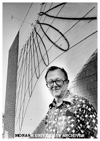 Senior lecturer Dr Carl Moppert with sun dial on wall of Union building