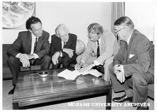 Signing of affiliation agreement between Monash and Bureau of Meteorology, from left: Professor John Swan, Professor Kevin Westfold, Dr John Zillman, Bureau director, and Mr Jim Butchart, University Registrar