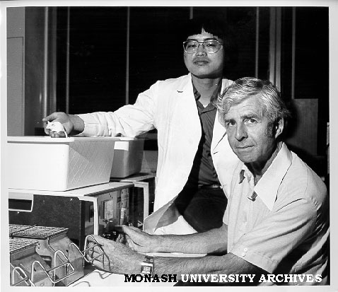 Associate Professor G. Bentley (right) and student John Wong using activity meter to test drug effects