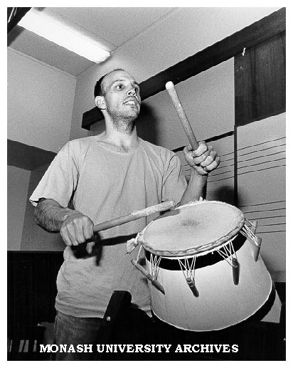 Mr Chris Lesser leader of Melbourne based African musical-dance group, Adzohu, playing Ghanian drum