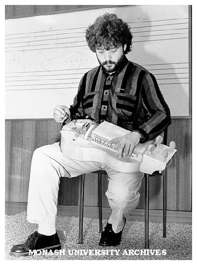 Hungarian musician Robert Mandel playing hurdy-gurdy