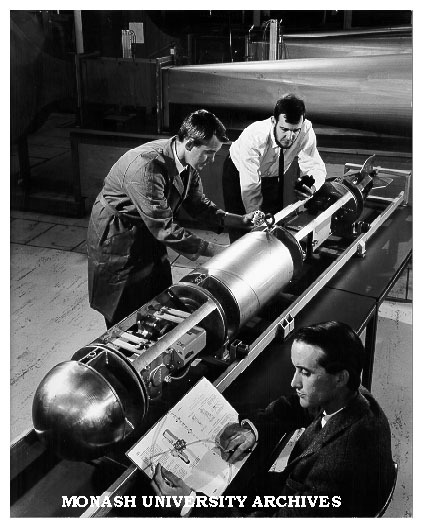 Dr Deane Blackman (foreground) with submarine vessel, with Dr J. B. Hinwood and Senior Technical Officer Mr Brian Mayor