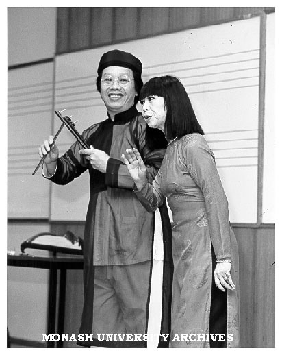 Vietnamese music scholar Tran Quang Hai playing coin clappers while wife Bach Yen sings