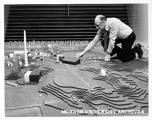 Technical officer George Perry with model of Mt Isa chimney stack used to calculate wind speed and test its effects