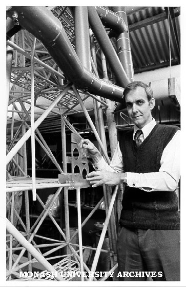 Associate Professor Jon Hinwood with model of Woodside Petroleum's North Rankin A rig