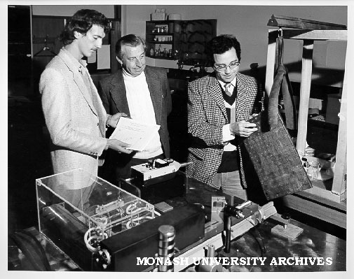 Student Keith Edwards (left), Dr Rod Tobin and Dr Len Koss, preparing bismuth target for vibration testing of structural material