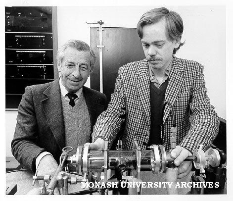 Dr Rod Tobin (left) and student Nigel Perry checking experimental metal vapour laser