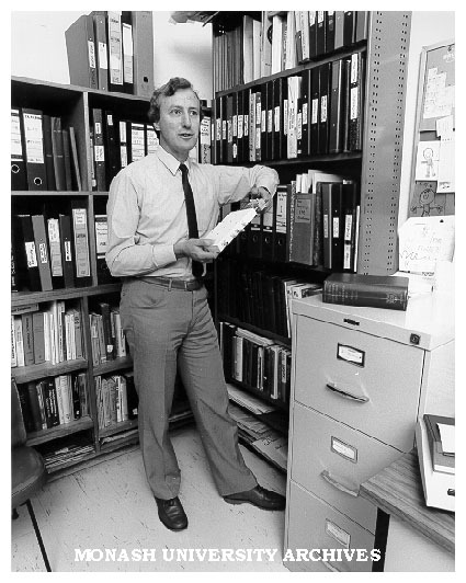 Dr John Pilbrow with records relating to his compact electron spin resonance spectrometer