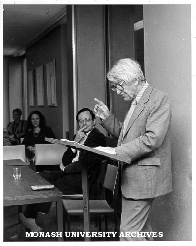 Hector Monro speaking at the launch of 'Don Juan in Australia'. Organiser Philip Martin seated centre